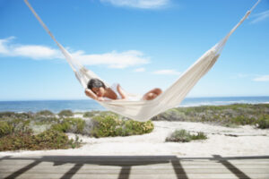 Woman sleeping in a hammock